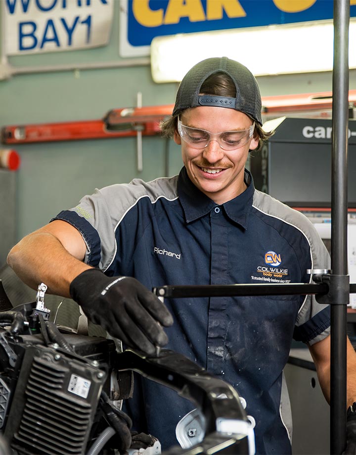 Col Wilkie Body Works team member working on vehicle