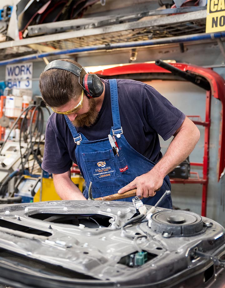 Col Wilkie Body Works team member working on vehicle